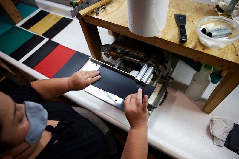Gluing pockets before sewing leather journals Oberon Design