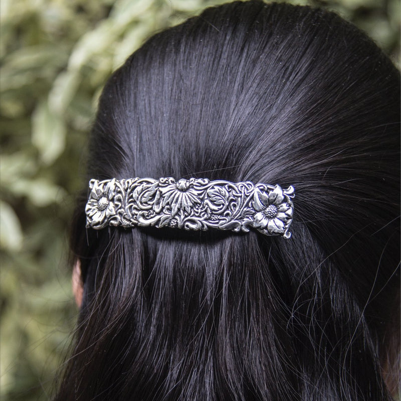 Flowers and Flora embossed designs on leather and hand cast jewelry by