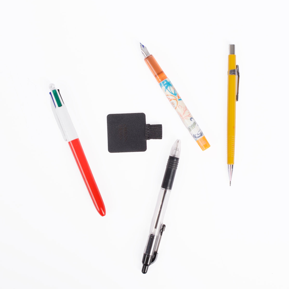 Leather and elastic Self-adhesive Pen Loop, grouped with pens, by Oberon Design